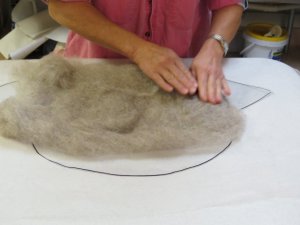 Shaping felt to pattern.