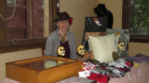 Vicky sells Día de los Muertos items.